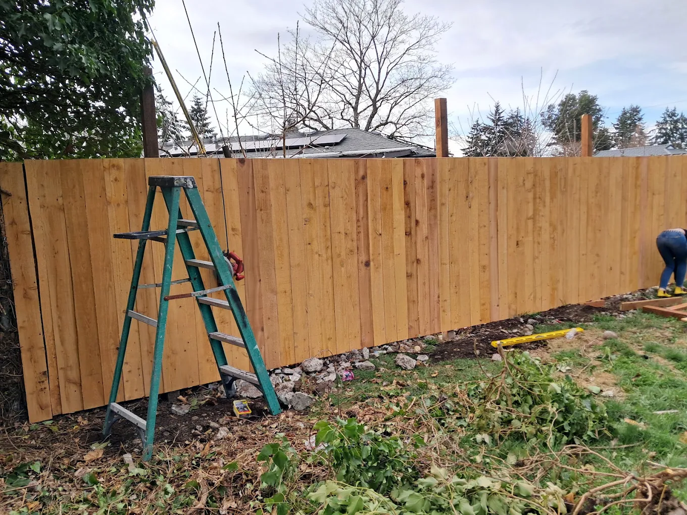 Wood privacy fence installation